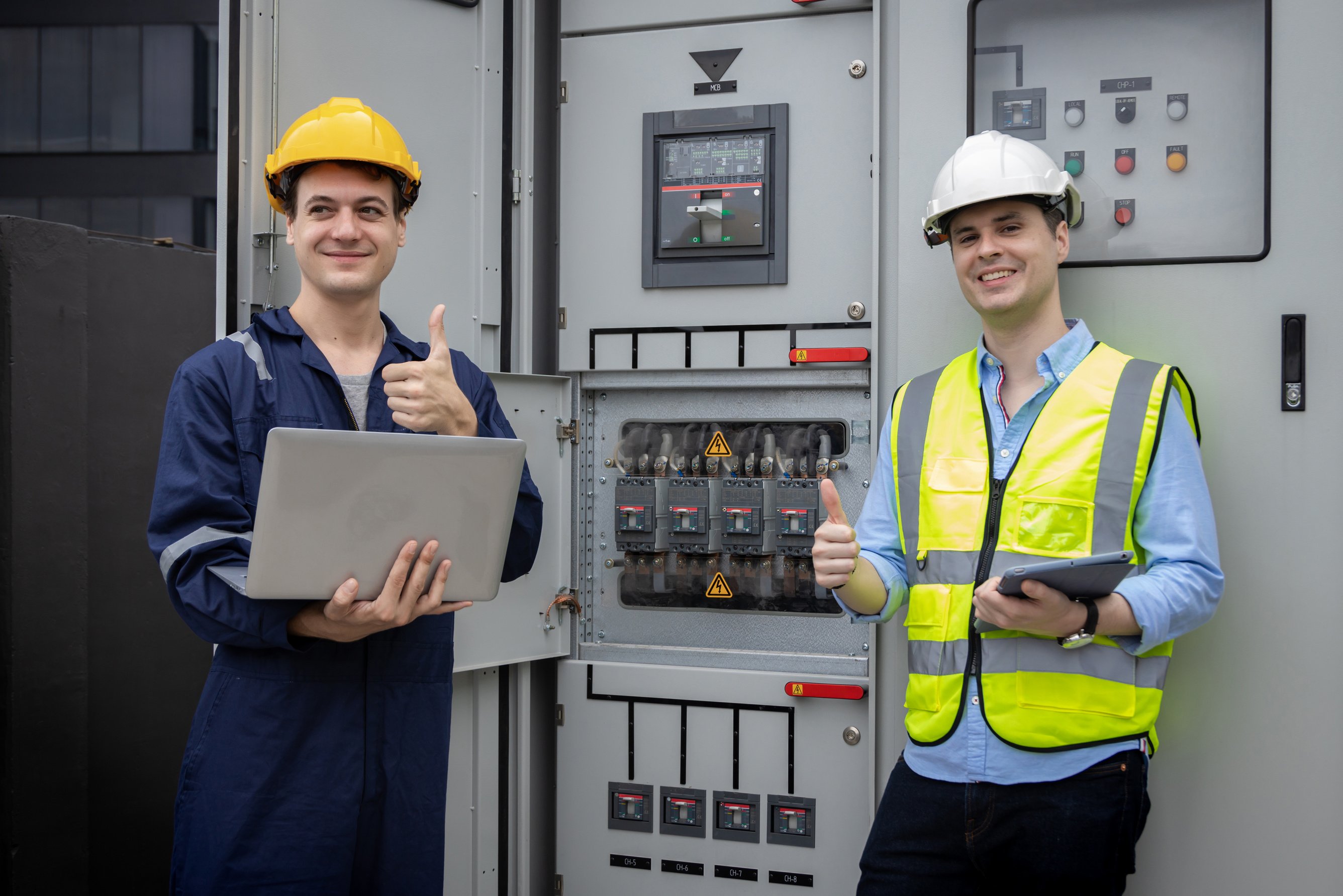 Electrical engineer working in control room. Electrical engineer